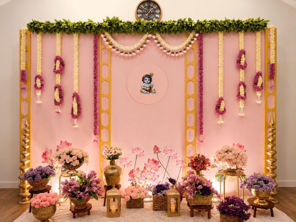 Annaprasana backdrop in pink with garlands, lanterns and lotus artwork